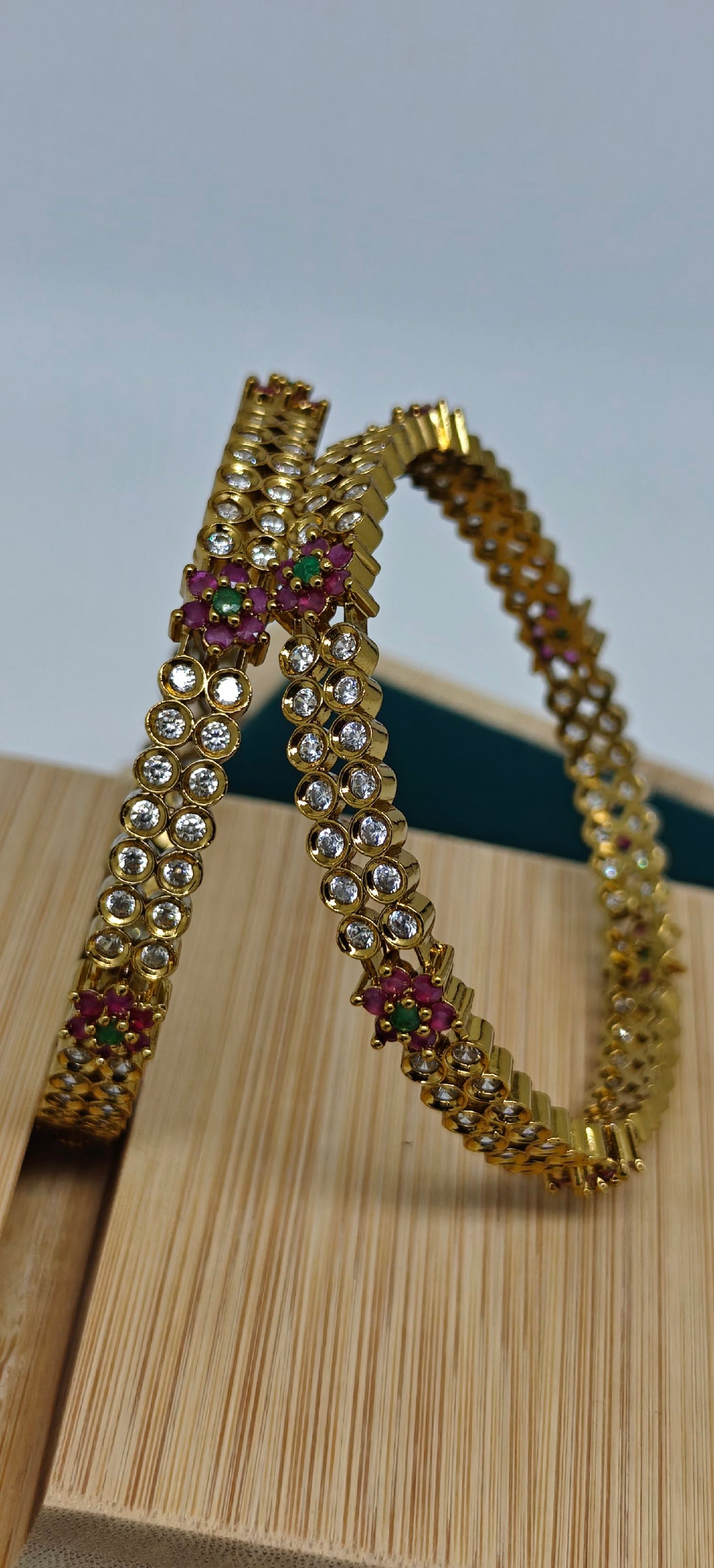 Ad bangles with multi colour stones